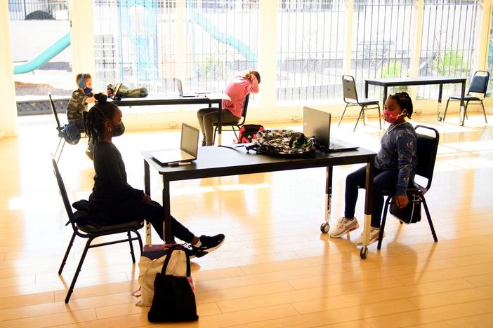 Children attend online classes at the Crenshaw Family YMCA in Los Angeles. Schools are having a hard time covering the costs required for in-person and online learning during the pandemic.