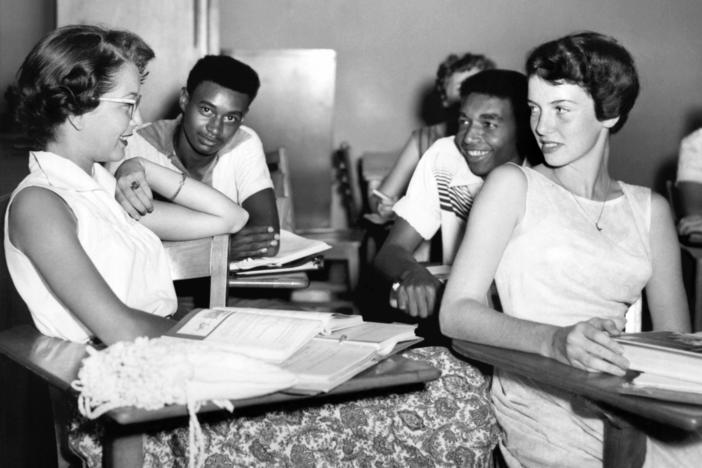 Students chat while waiting for history class to start at Oak Ridge High School in September of 1955, when the once all-white high school was desegregated by order of the Atomic Energy Commission. The Tennessee city's school board is now formally including the story of its integration in its curriculum.