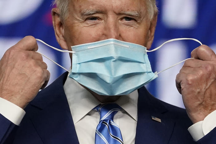 President Joe Biden, pictured on the campaign trail in Nov. 2020, has long encouraged Americans to mask up in the fight against COVID-19. On Wednesday, his administration announced it will provide 25 million masks to community health centers and food banks across the country.