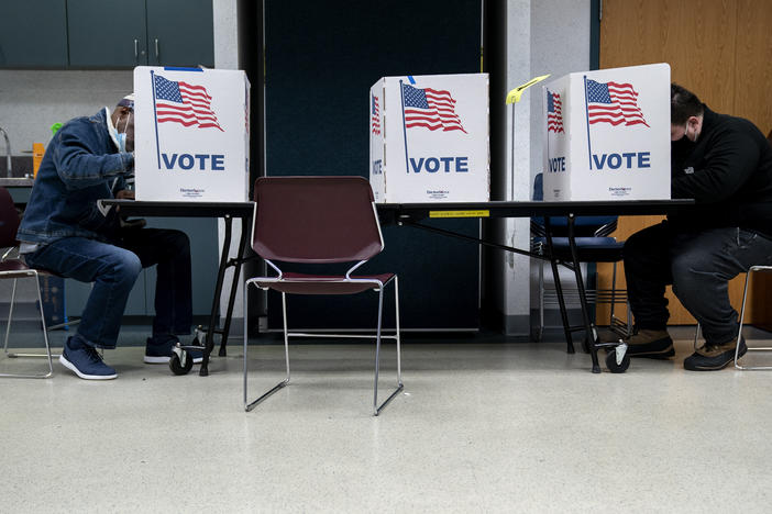 Voters fill out 2020 general election ballots in Alexandria, Va. A state-level Voting Rights Act is now on the governor's desk.