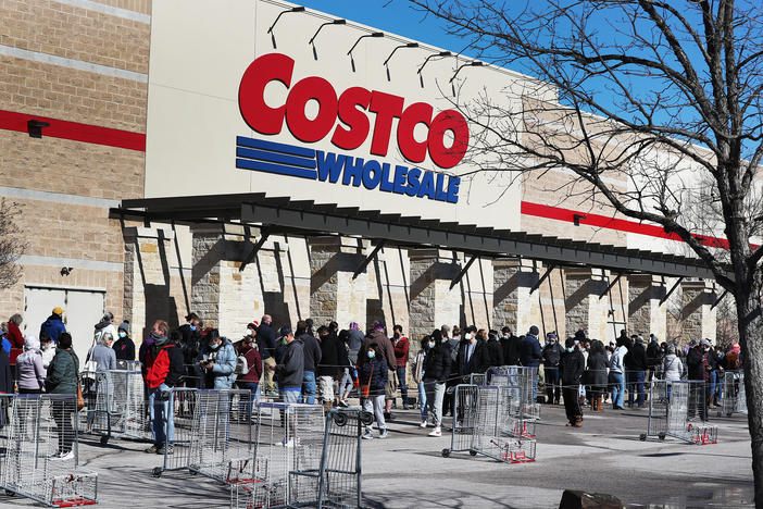 People wait to shop at a Costco in Texas on Feb. 20. Next week's pay increase would put Costco ahead of much of the industry.