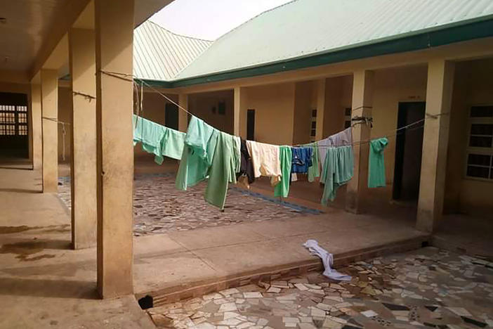 School uniforms hang in the deserted dormitory of the Government Girls Science Secondary School at Jangede, Zamfara State in northwest Nigeria, where more than 300 students were kidnapped by gunmen early Friday, local time.