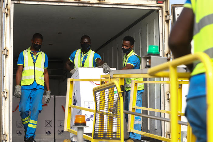 Ghana is the first country to receive a shipment of COVID-19 vaccines from the global COVAX program. Above: The vaccines are unloaded at the Kotoka International Airport in Accra on February 24.
