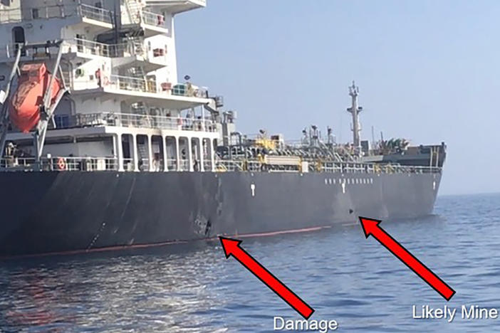 This June 2019 image released by U.S. Central Command, shows damage and a suspected mine on the MV Kokuka Courageous in the Gulf of Oman near the coast of Iran. The U.S. said Iranian forces were responsible.