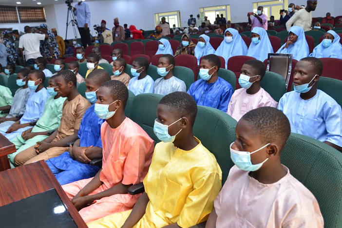 Abducted students of Government Science College Kagara sit in the state conference hall after being freed in Minna, Niger state, Nigeria, on Saturday.