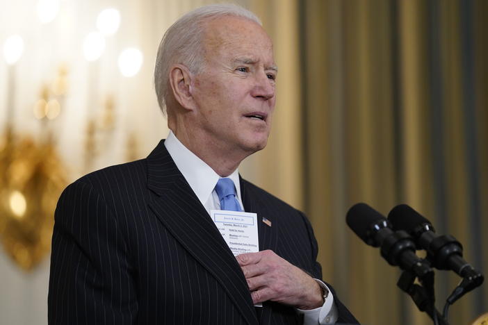 President Biden keeps a note card in his suit pocket with the running tally of how many Americans have died from COVID-19 and how many have been vaccinated.