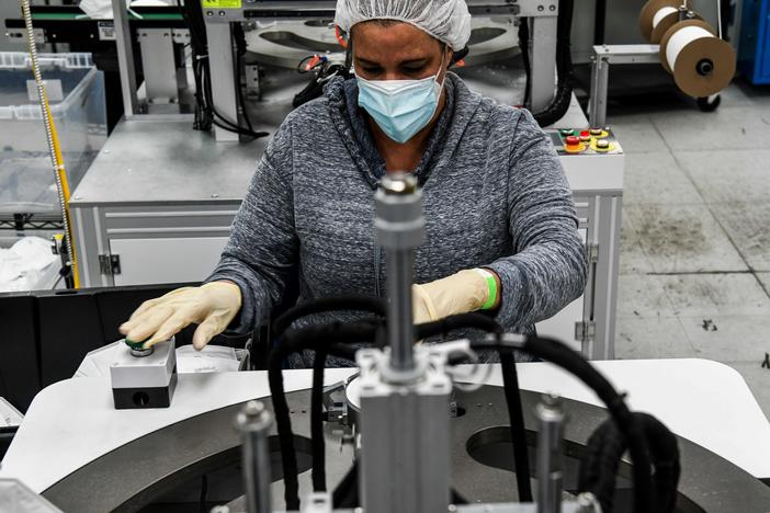 An employee makes respiratory masks in a family-owned medical equipment factory in Miami on Feb. 15. American manufacturers are thriving but they are running into an unexpected problem: finding critical supplies.