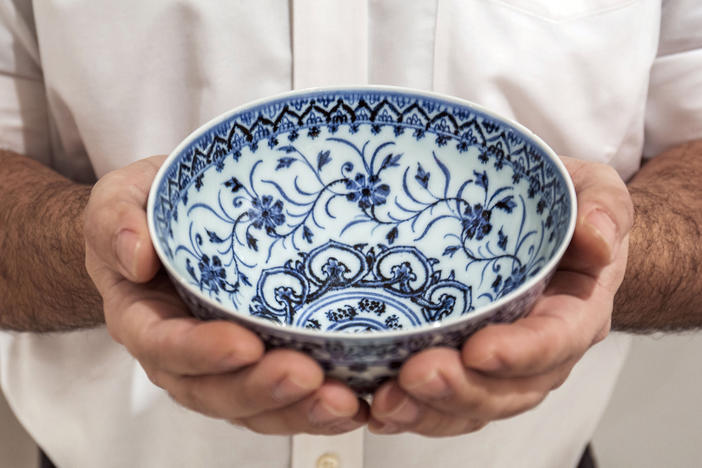 A small porcelain bowl, pictured in a photo provided by Sotheby's, cost $35 at a yard sale but was later identified as a rare, 15th-century Chinese artifact worth between $300,000 and $500,000.