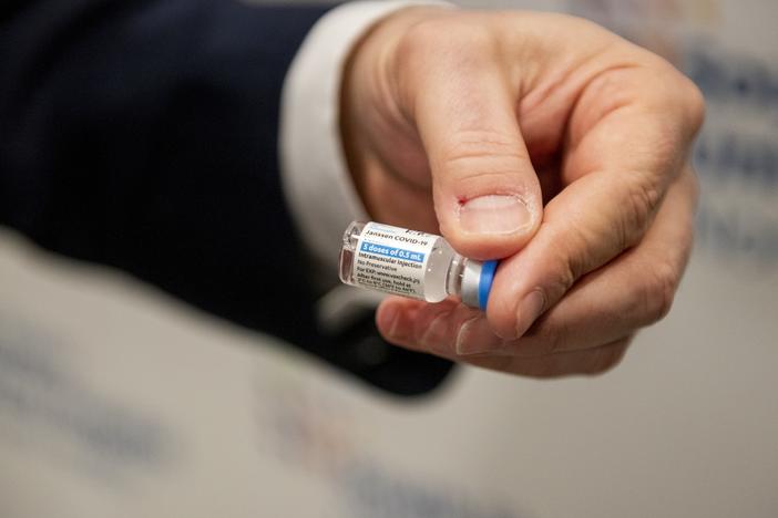 A health care worker holds a vial of the Johnson & Johnson COVID-19 vaccine at South Shore University Hospital in Bay Shore, N.Y., on Wednesday.