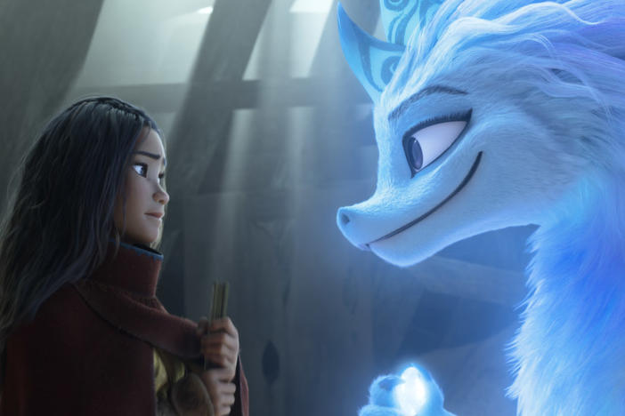 Raya, a young warrior princess (Kelly Marie Tran), enlists the help of Sisu, a friendly water dragon (Awkwafina) in <em>Raya and the Last Dragon. </em>