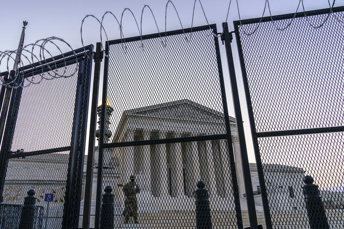 National Guard troops keep watch Thursday at the Supreme Court.