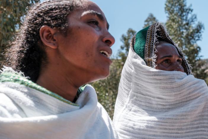 Women mourn the victims of a massacre allegedly perpetrated by Eritrean soldiers in the village of Dengelat, north of Mekele, the capital of Tigray.