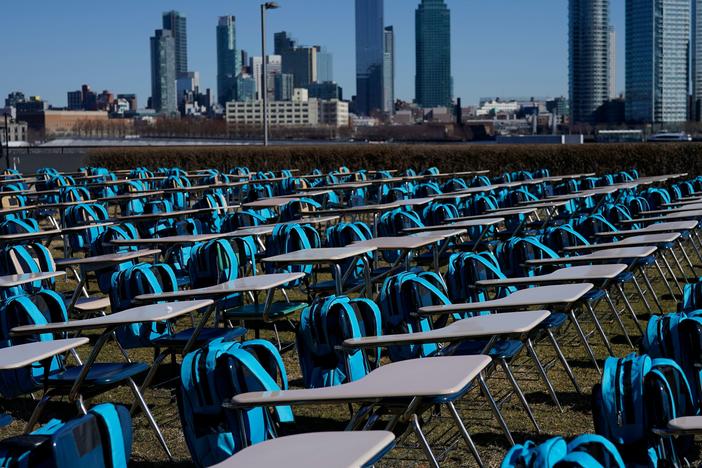 School desks make up an exhibit called "Pandemic Classroom" at the United Nations in New York City. Each of the 168 seats represents 1 million children living in countries where schools have been entirely closed almost a year.