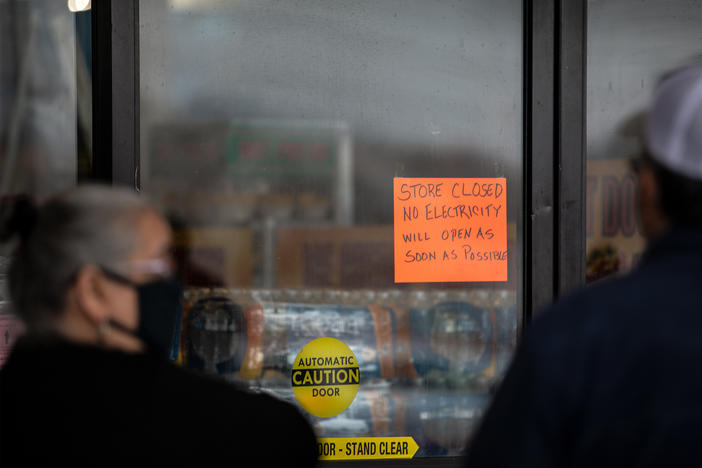 People wait in line for Fiesta Mart to open after the store lost electricity in Austin, Texas on February 17, 2021.