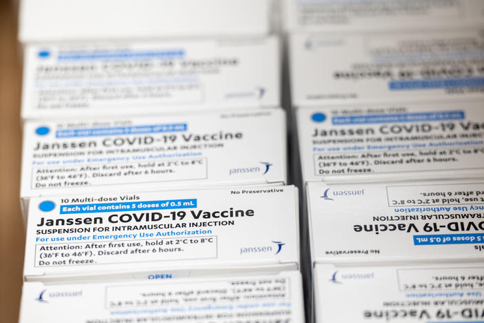 Boxes containing vials of the Janssen COVID-19 vaccine sit in a container before being transported to a refrigeration unit at Louisville Metro Health and Wellness headquarters on March 4 in Louisville, Ky. The FDA approved the third COVID-19 vaccine on Feb. 27.