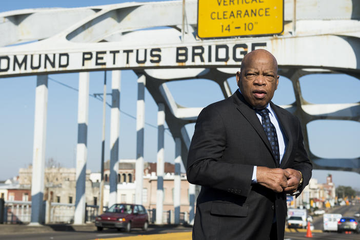 In 2015, the late Rep. John Lewis stands on the Edmund Pettus Bridge in Selma, Ala., where he was beaten by police on "Bloody Sunday."
