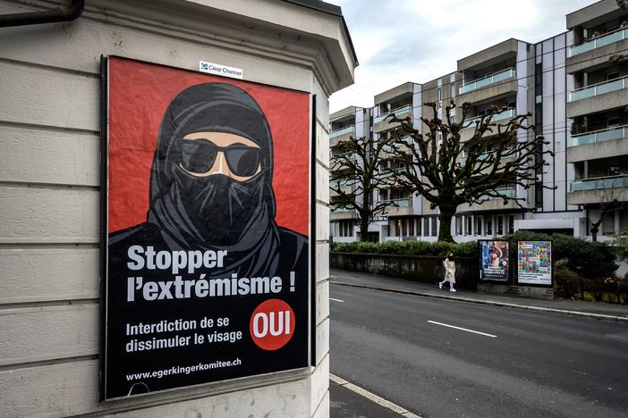 A poster in Lausanne, Switzerland, reads "Stop extremism!" The Swiss passed a new ban on facial coverings in public in a narrow 51.2% majority vote Sunday.