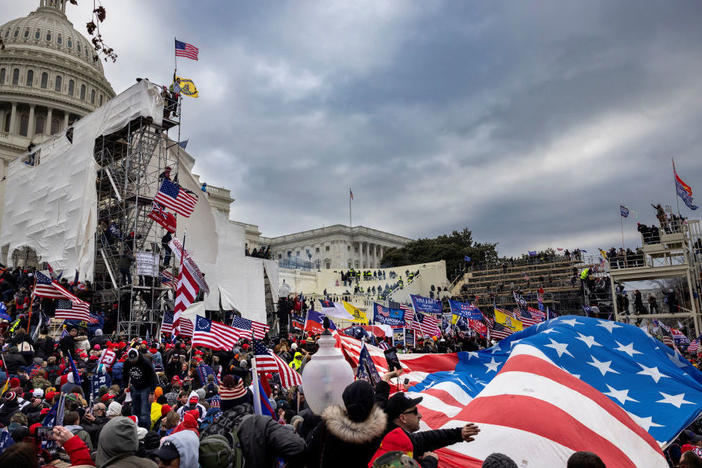 Rioters storm the Capitol on Jan. 6. Among those charged in connection with the insurrection are members of the paramilitary group the Oath Keepers.
