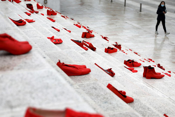 The red shoes are part of a public art installation denouncing violence against women. The photo was taken at Durresi main square in Tirana, Albania, on March 8 — International Women's Day.