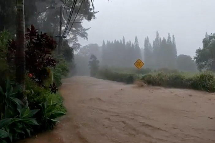 A road is flooded near the breached Kaupakalua Dam in the Haiku area of the Hawaiian island of Maui on Monday.