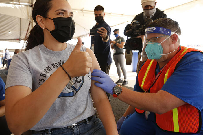 Miriam De La Torre receives a COVID-19 vaccine earlier this month. The LA Unified School District and the United Teachers LA union say they've reach a tentative agreement to return to in-person learning next month.