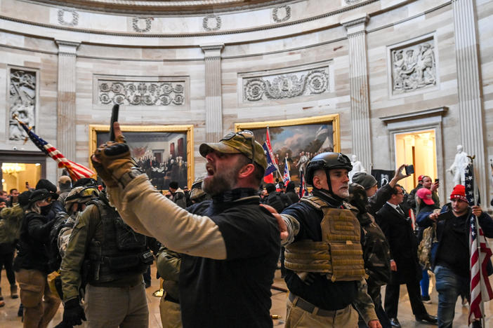 Kenneth Harrelson, identified in an FBI affidavit as the man at center holding a phone in the Capitol Rotunda, is charged with obstructing an official proceeding, destruction of government property, entering a restricted building and conspiracy.