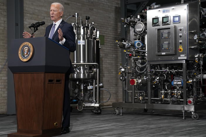 In a February visit to Pfizer's Kalamazoo, Mich., manufacturing complex, President Biden said the administration had "used the Defense Production Act to speed up the supply chain for ... key equipment, like fill pumps and filters, which has already helped increase vaccine production."