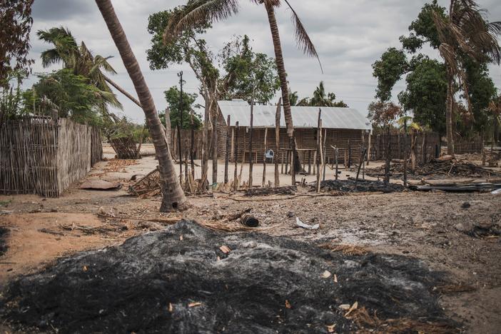 A mound of ashes is seen after an attack in the village of Aldeia da Paz outside Macomia, on Aug. 24, 2019. For the past three years, violence has devastated parts of northern Mozambique, leaving hundreds of thousands displaced.