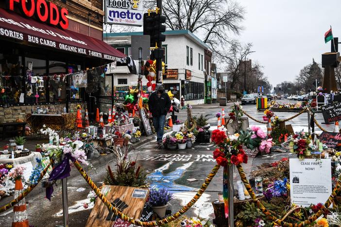 A makeshift memorial in Minneapolis honors George Floyd as jury selection begins in the trial of former police officer Derek Chauvin.