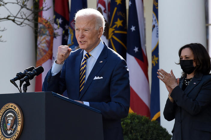 President Biden, with Vice President Harris behind him, speaks about the American Rescue Plan in the Rose Garden of the White House on Friday.