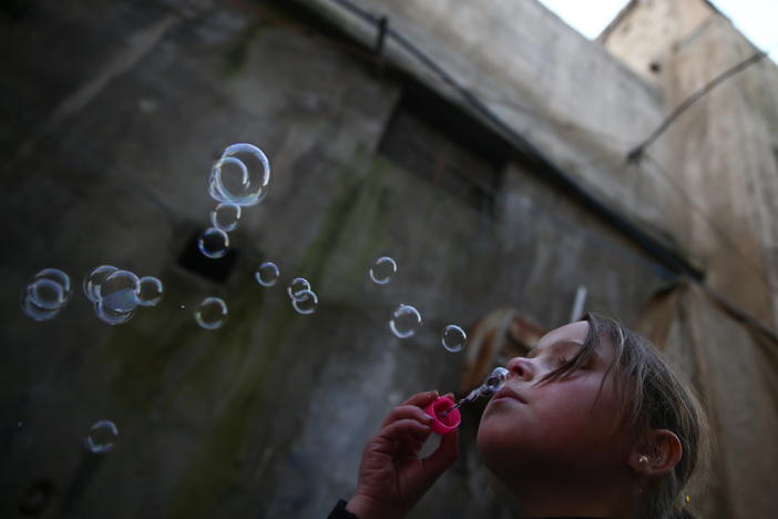 <strong>Jan. 19, 2017:</strong> <em>Douma</em> — A young girl blows bubbles.