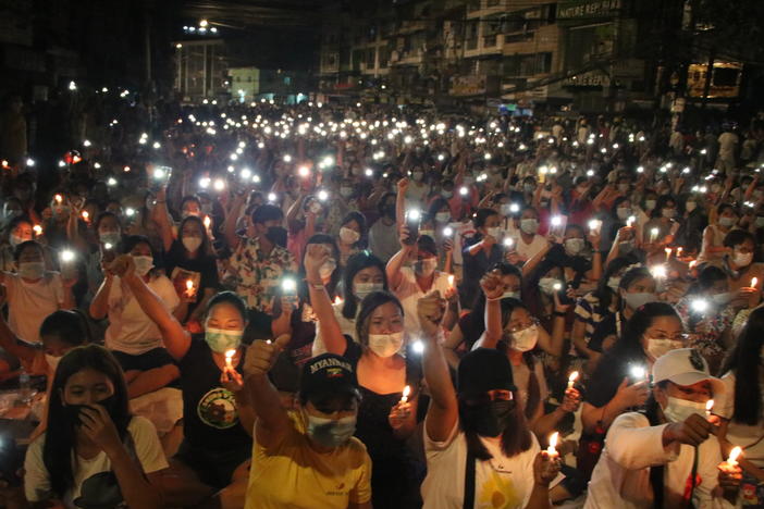 Protesters against last month's military coup hold a candlelight rally in Yangon, Myanmar, on  Saturday. More than 70 people have been killed by security forces since the military overthrew the country's fragile democracy six weeks ago, a United Nations official says.