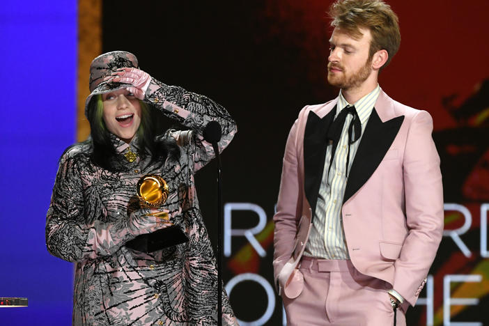 Billie Eilish (left) and FINNEAS accept the Record of the Year award for Eilish's song "Everything I Wanted" during the 63rd annual Grammy Awards on Sunday.