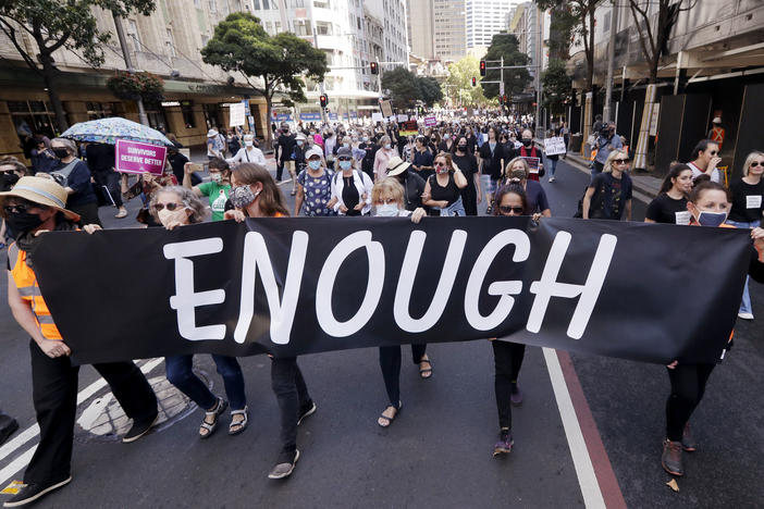 Thousands of people with placards and banners rally in Sydney on Monday, demanding justice for women. The rally was one of several across Australia including in Canberra, Melbourne, Brisbane and Hobart.