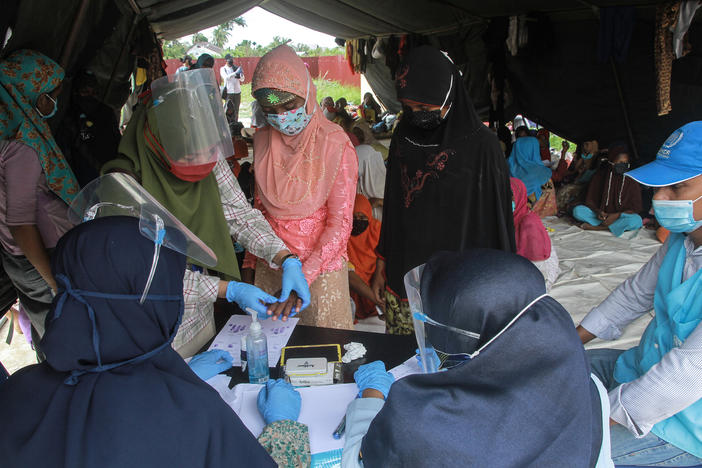 Rohingya refugees at a work training center in Indonesia's Aceh province. Dr. Paul Spiegel of Johns Hopkins University's Center for Humanitarian Health is looking at the data that have been collected on refugees and other vulnerable populations. It's far from complete, he says, but he has been surprised by the impact of COVID-19 among Rohingya.