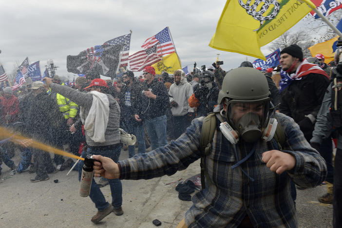 Pro-Trump extremists clashed with police during the storming of the U.S. Capitol on Jan. 6. The rioters may not have fired shots, but many were armed with other weapons, court documents show.