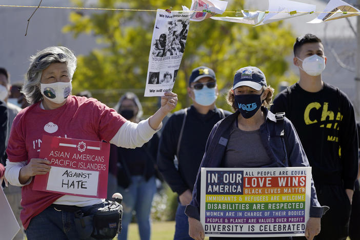 People attend a community rally to raise awareness of anti-Asian violence and racist attitudes, held at Los Angeles Historic Park near the Chinatown district in Los Angeles, Saturday, Feb. 20, 2021.