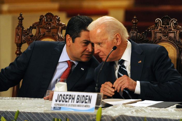 Honduran President Juan Orlando Hernández (left) speaks with then-Vice President Biden during a news conference in Guatemala City on March 2, 2015. Leaders from Guatemala, El Salvador and Honduras were meeting with Biden for two days of talks about child migrants entering the United States.