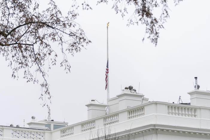 The American flag files at half-staff at the White House on Thursday.