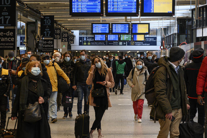 Travelers waited to flee Paris at the Montparnasse Train Station on Friday ahead of a new lockdown announced by the government in response to a surge in cases of the coronavirus.