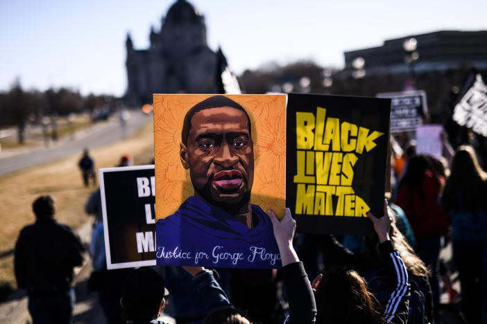 Opening arguments are slated to begin in former Minneapolis police officer Derek Chauvin's murder trial on March 29. Here, people march near the Minnesota state Capitol to honor George Floyd on Friday in St. Paul, Minn.