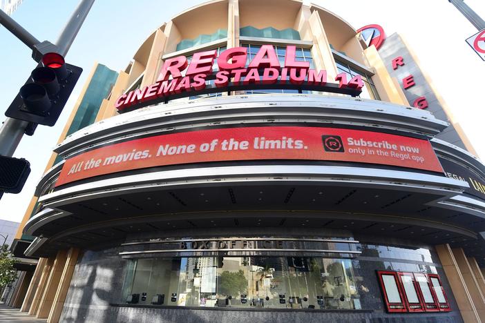 Regal Cinemas says it will reopen its U.S. theaters next month. A closed box office is seen here in Los Angeles in June after theaters were closed due to the pandemic.