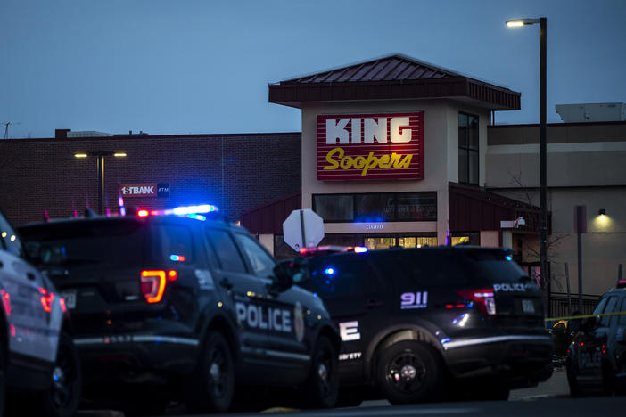 Police respond to an attack on a King Soopers grocery store in Boulder, Colo., where a gunman opened fire Monday. Ten people, including a police officer, were killed.