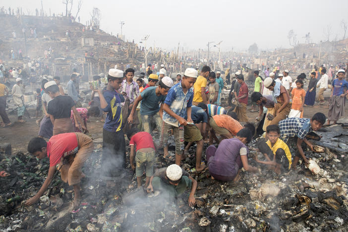 Rohingya refugees search for their belongings after a massive fire broke out at the Balukhali refugee camp, Cox's Bazar, Bangladesh, on Monday.