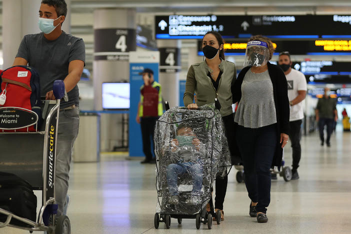 With precautions such as mask-wearing in place, experts predict travel is among the activities that may become safer by this summer.