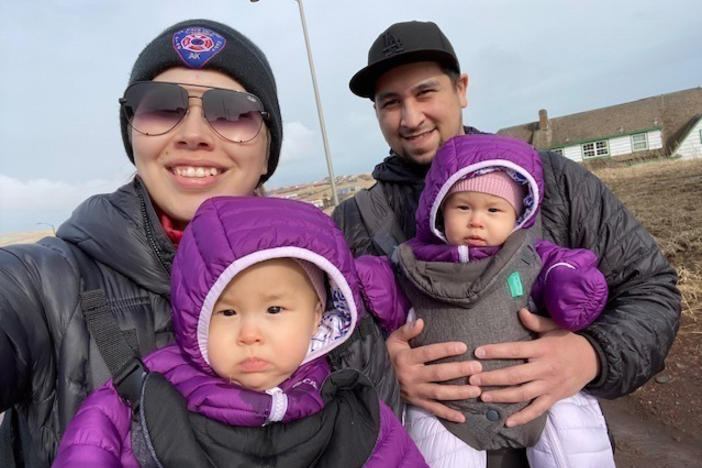 Cara Lestenkof-Mandregan, John Melovidov and their twin daughters, Anna and Mila, go for a walk on St. Paul Island, Alaska.