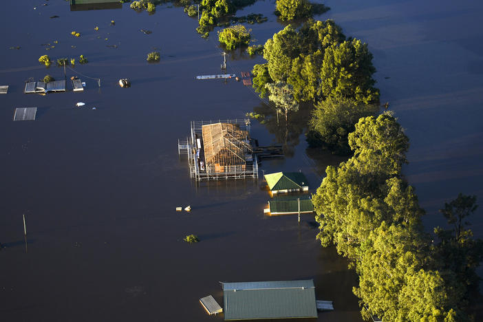 Buildings are partially submerged as floodwater covers large areas of northwest of Sydney on Wednesday.