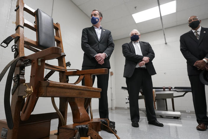Virginia Gov. Ralph Northam (left) looks over the electric chair in the death chamber at the Greensville Correctional Center with Operations Director George Hinkle (center) and the director of the Department of Corrections, Harold Clarke, prior to signing a bill abolishing the penalty Wednesday.