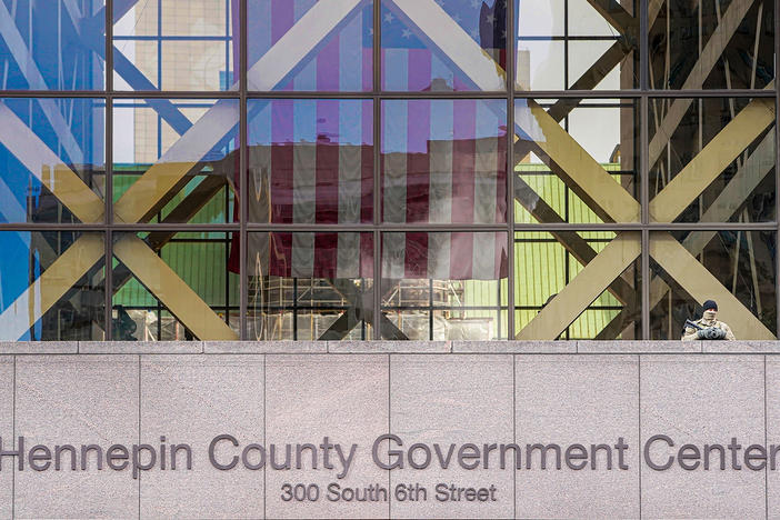 A member of the Minnesota National Guard stands outside the Hennepin County Government Center during jury selection in the trial of former Minneapolis police officer Derek Chauvin on March 11 in Minneapolis. Chauvin is facing murder charges in George Floyd's death. Among the 12 jurors and three alternates selected are three Black men, one Black woman and two multiracial jurors.