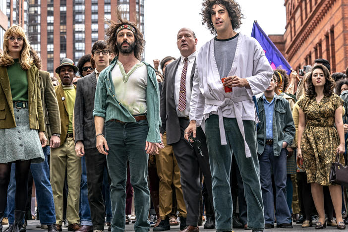 Sacha Baron Cohen, front right, plays Abbie Hoffman in <em>The Trial of the Chicago 7.</em>